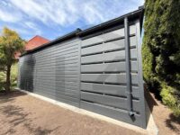 garaż blaszany jednospadowy z bramą segmentową orzech grafit wiata na zgłoszenie