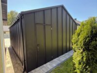 garaż blaszany 5x7 czarny z bramą segmentową na rąbek t-panel